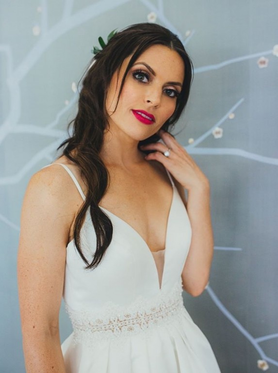 Catherine Peck, model wearing Illusion plunging wedding dress with adhesive stick on bra cups